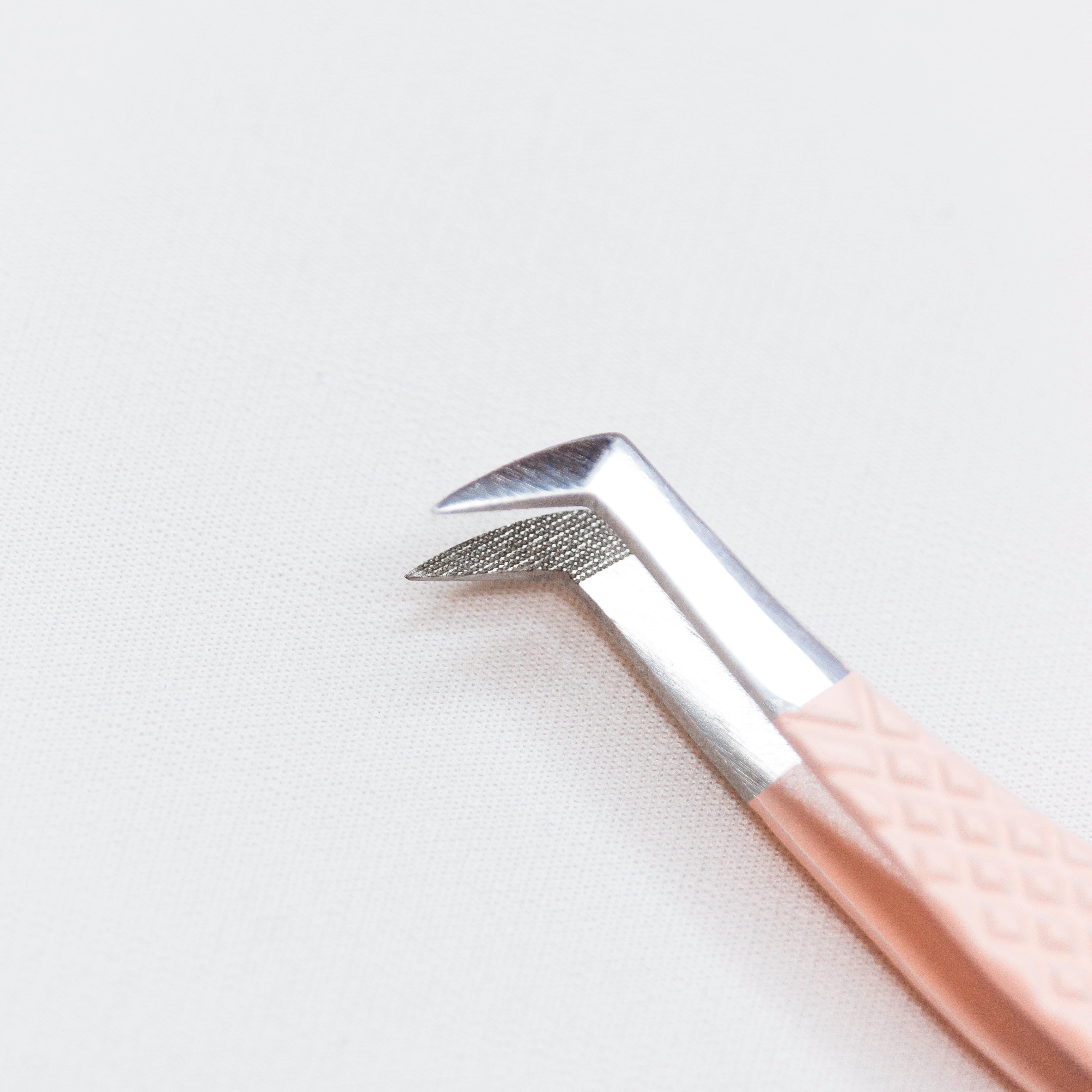 Closeup of the laser etched tips of the Boot Blush Nano Tip Lash Tweezer.