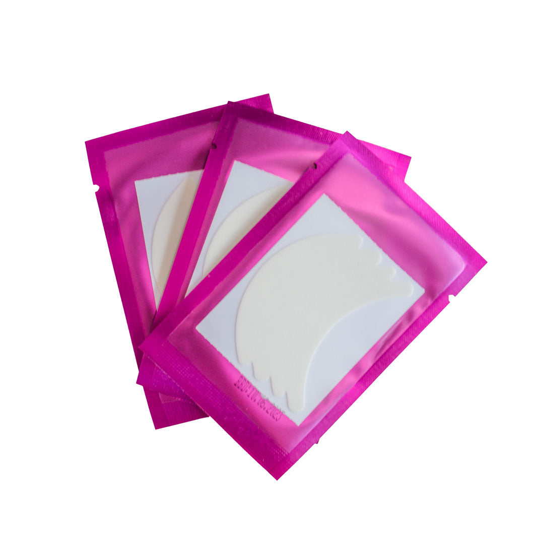 Three packages of flexi foam eye pads are shown. The packages are pink and the flexi foam eye pads are white.