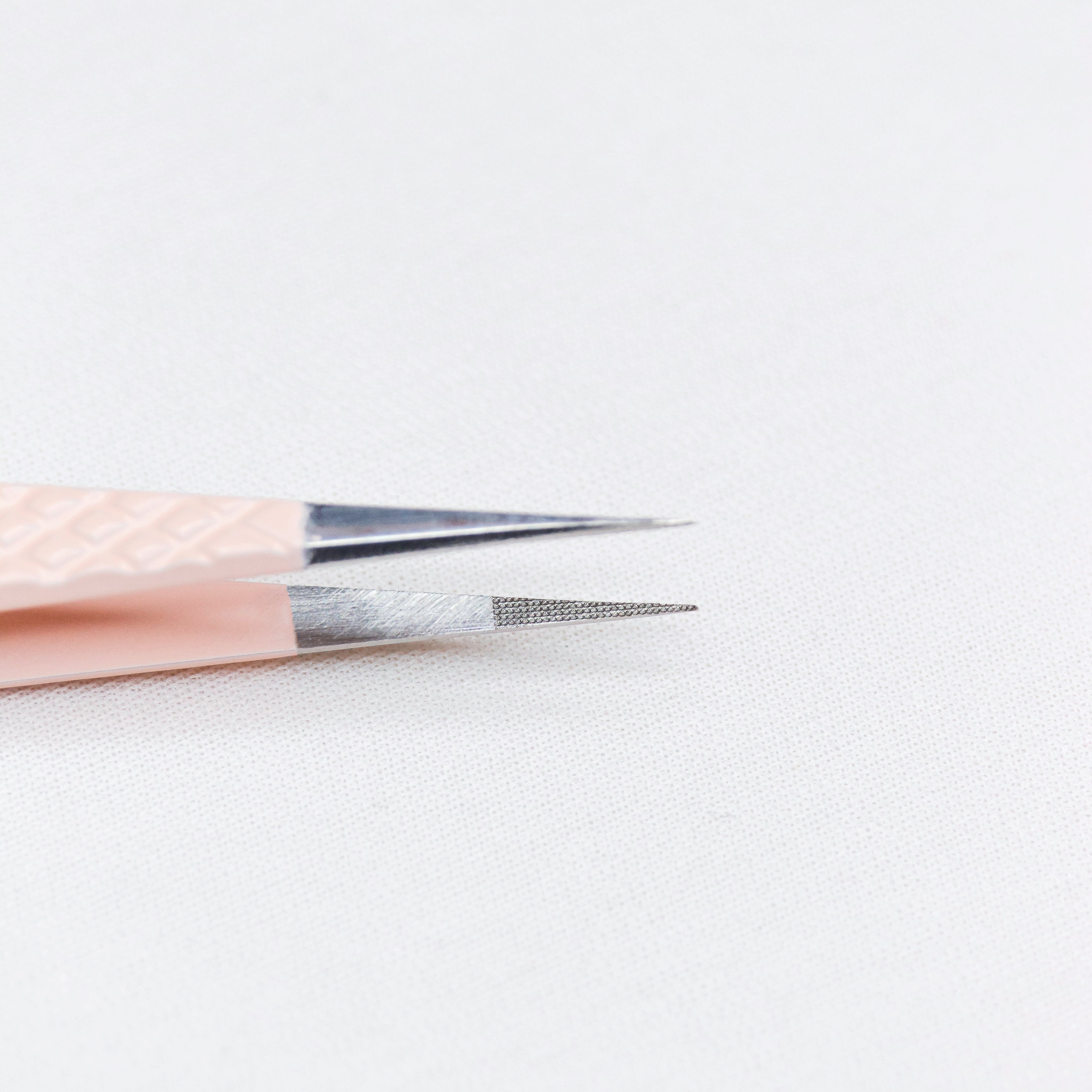 Close up view of the straight tips of the Straight Blush Nano Tip Lash Tweezer.