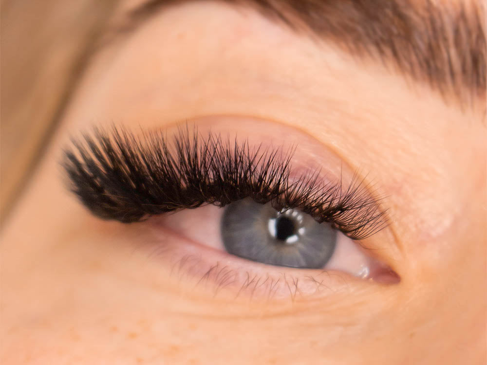 M curl lash extensions on a person with blue eyes. 