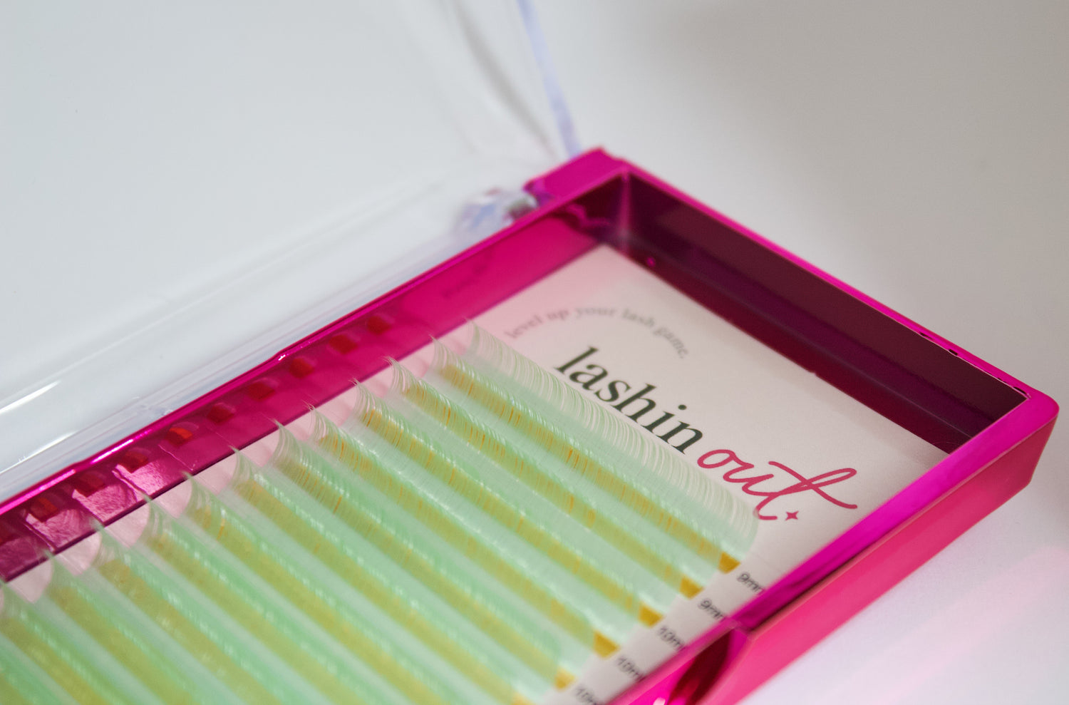 A tray of mint green lashes. The words &