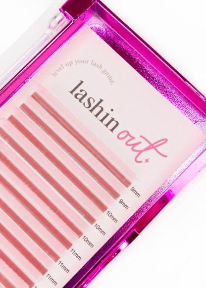 A tray of pink eyelash extensions. Each strip is a different size. There are two strips of 9mm, 3 strips of 10 mm, 3 strips of 11 mm. 