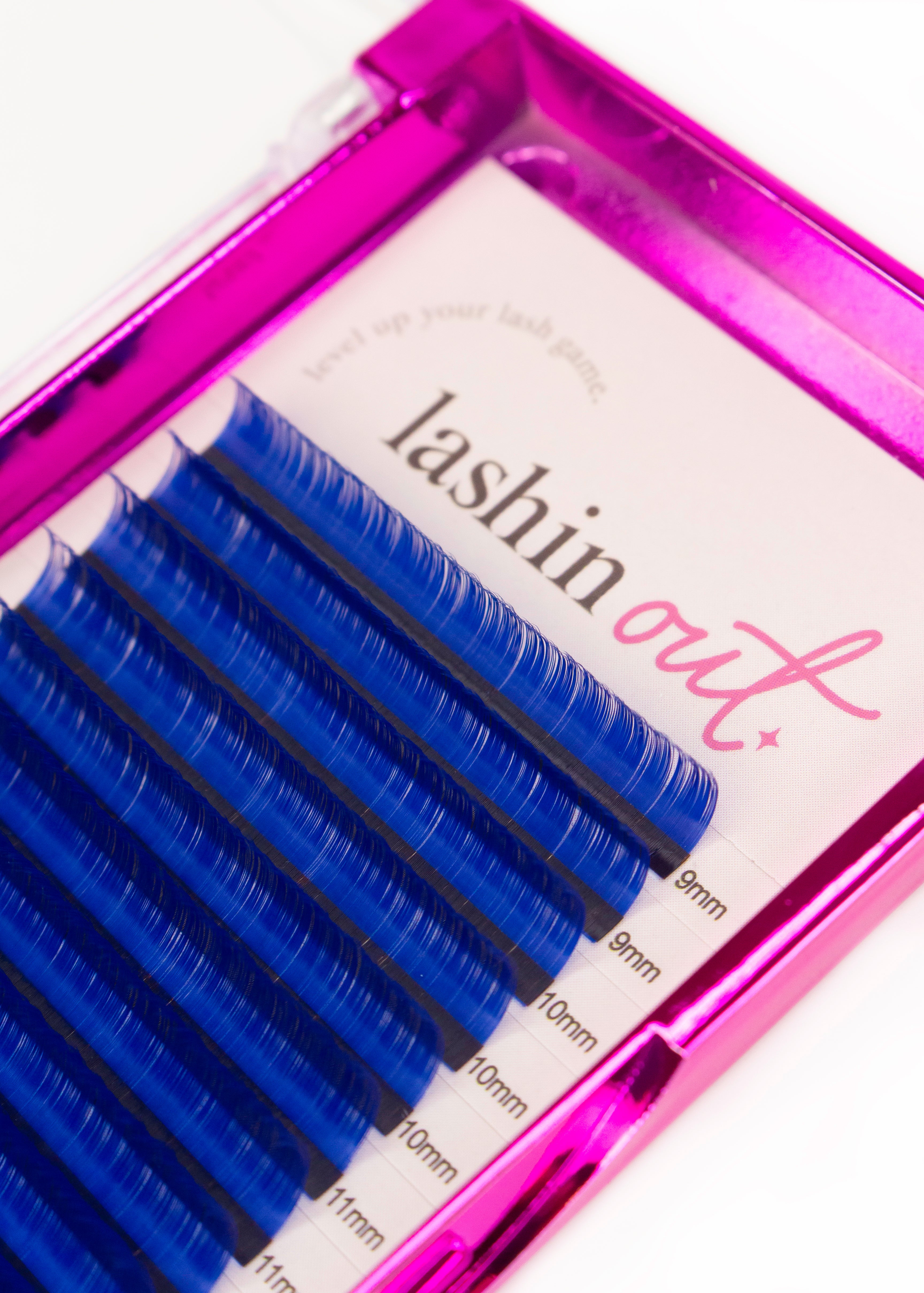A tray of blue lashes. There are two strips of 9mm, 3 strips of 10mm, and 2 strips of 11 mm are shown. 