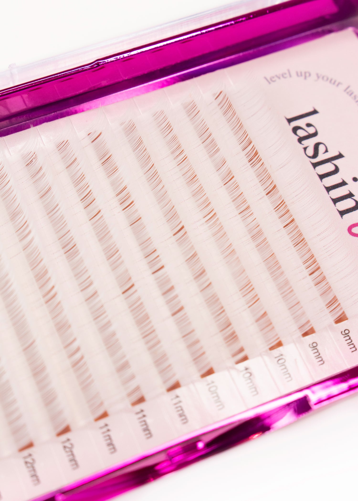 A tray of white lashes. There are 2 strips of 9mm, 3 strips of 10mm, 3 strips of 11mm and 2 strips of 12mm shown. 