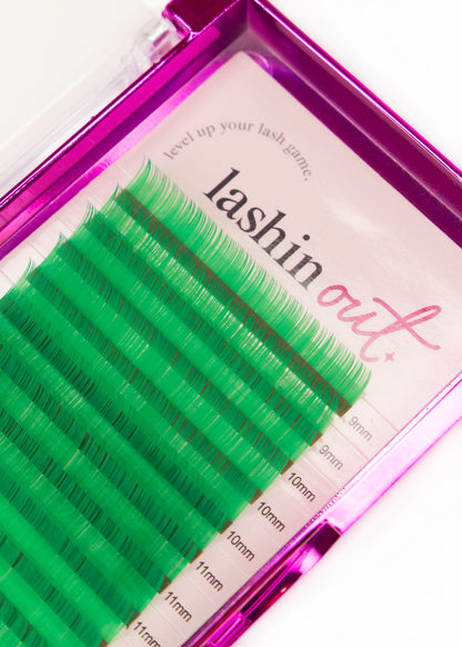 A tray of green lashes. There are 2 strips of 9mm, 3 strips of 10mm, and 3 strips of 11mm shown. 