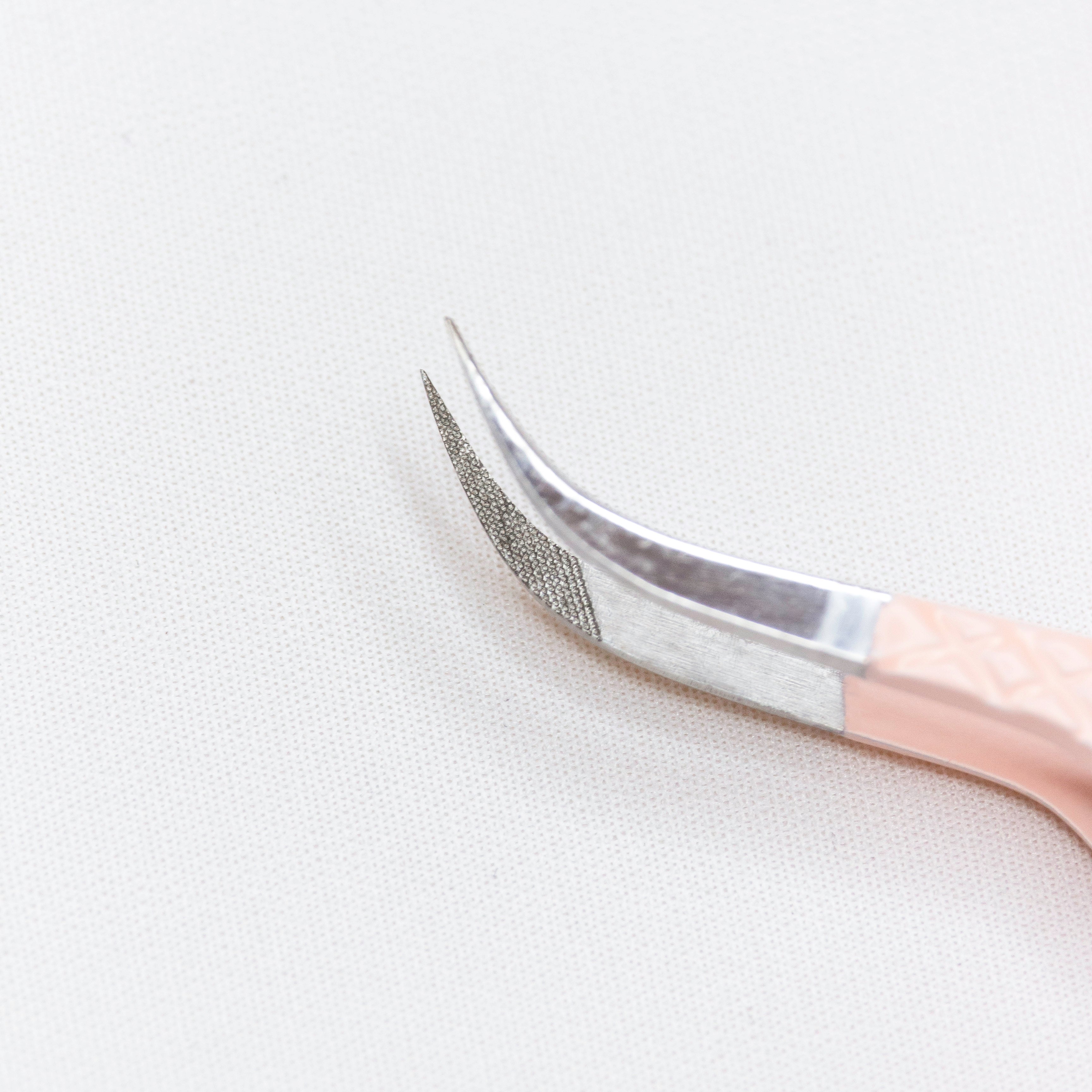 Close up of the curved tips of the Curved Blush Nano Tip Lash Tweezer