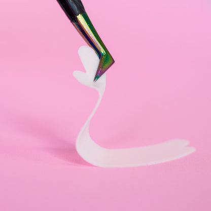 A pair of tweezers is holding a flexi foam eye pad