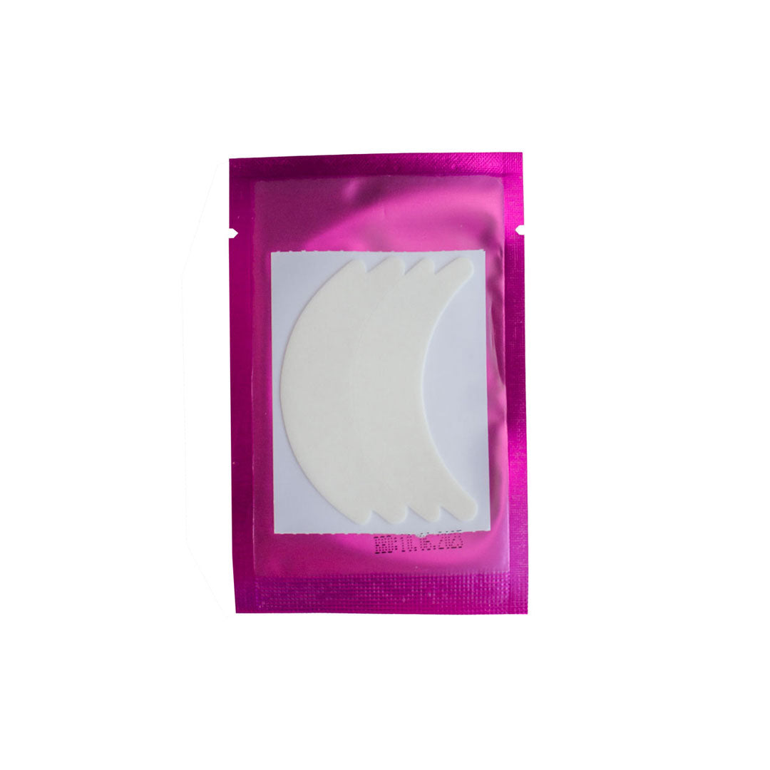 A package of flexi foam eye pads. The package is pink and the flexi foam pads are white. 