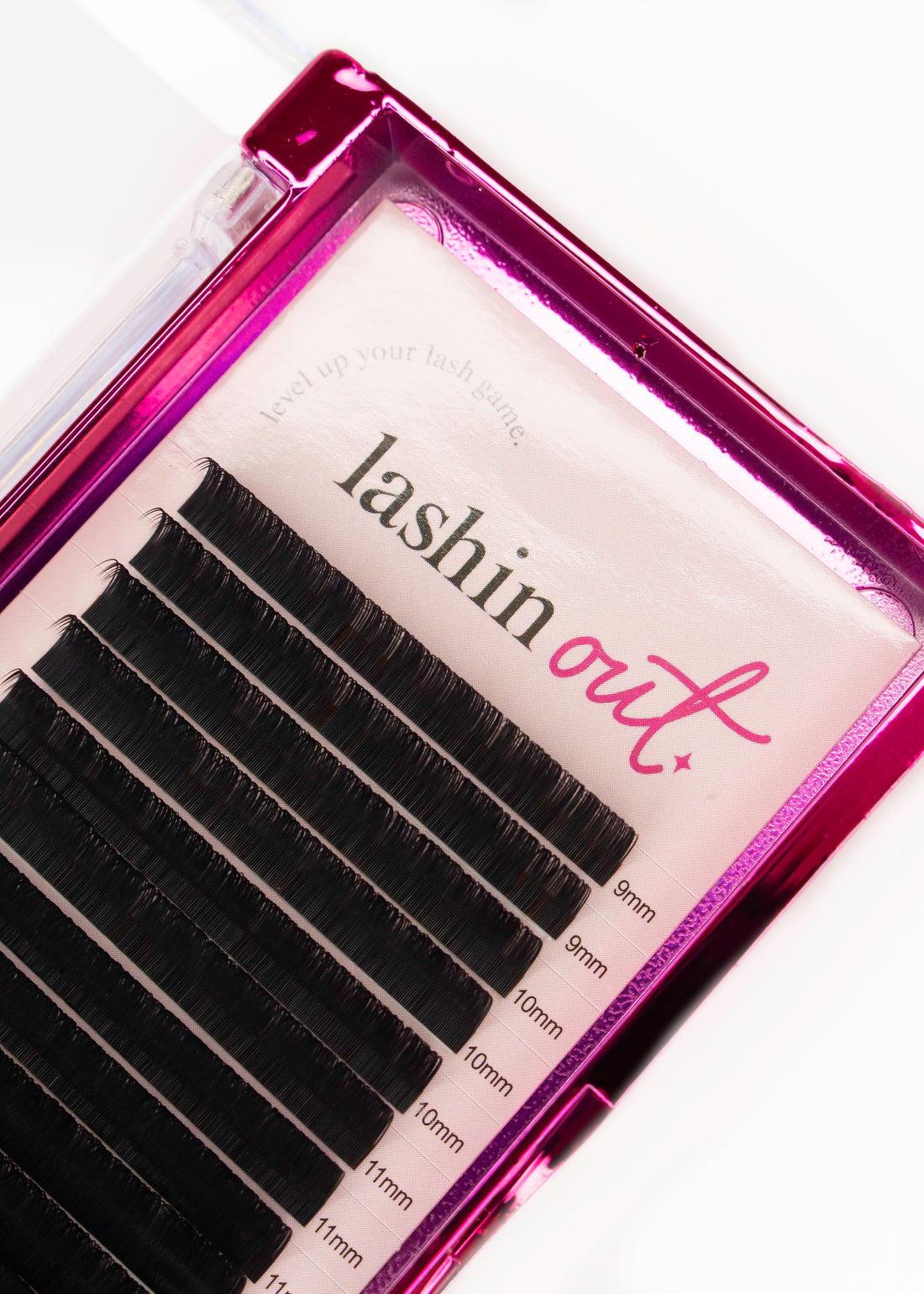 Pink tray of mixed length classic lashes. The words &