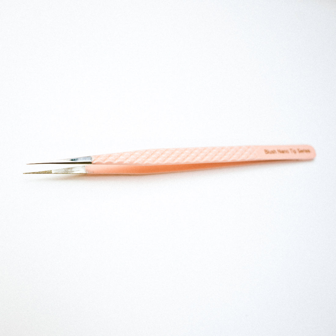 Top view of the Slim Blush Nano Tip Lash Tweezer. 