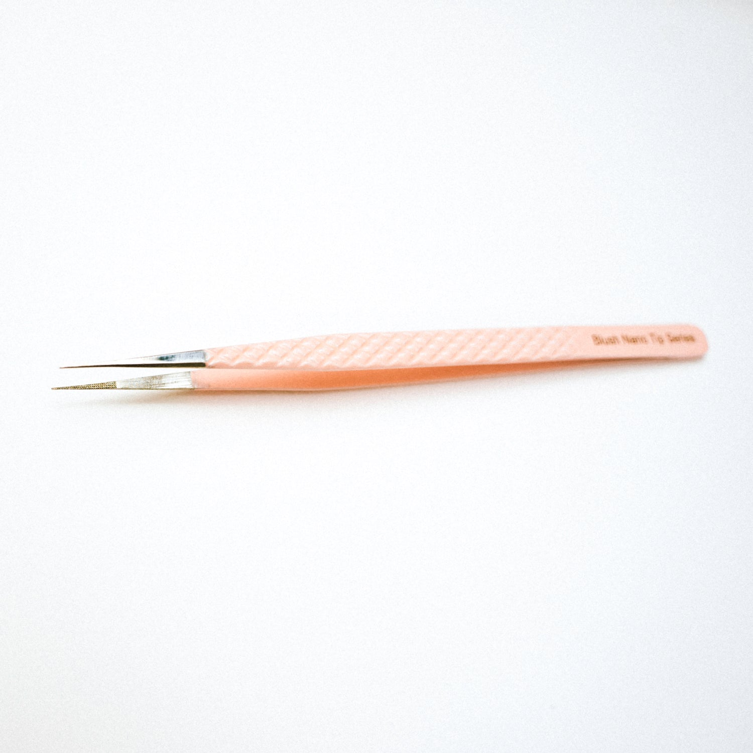 Top view of the Slim Blush Nano Tip Lash Tweezer. 