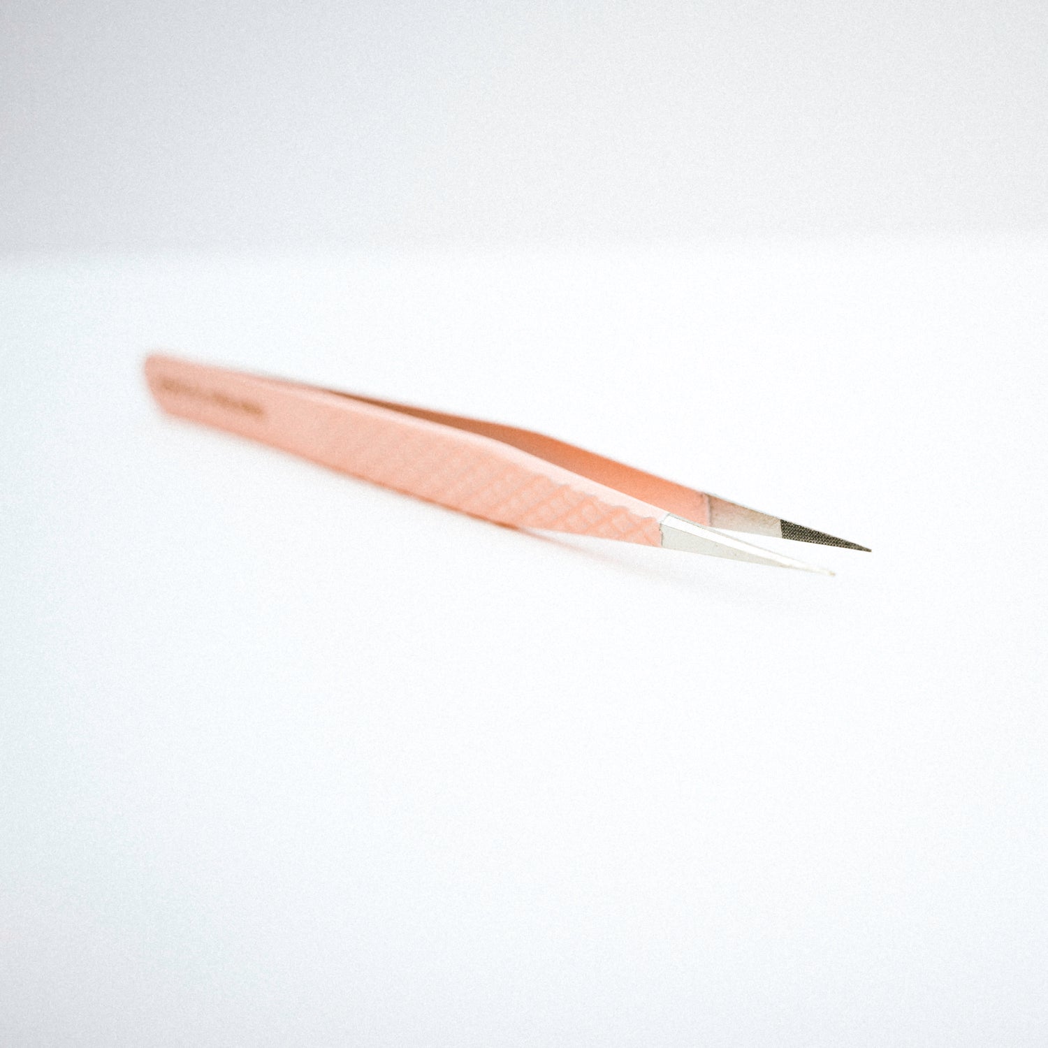 Front view of the Straight Blush Nano Tip Lash Tweezer. The pointed, straight tips are clearly seen.