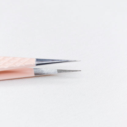 Close up view of the straight tips of the Straight Blush Nano Tip Lash Tweezer. 